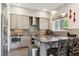 This contemporary kitchen features stainless appliances, gray backsplash, and stylish cabinetry at 2898 W 22Nd Ave, Denver, CO 80211