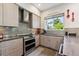 A modern kitchen featuring stainless steel appliances, stylish cabinets, and ample counter space at 2898 W 22Nd Ave, Denver, CO 80211