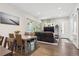 Open-concept living area with hardwood floors, modern furniture, and natural light from sliding glass doors at 2898 W 22Nd Ave, Denver, CO 80211