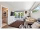 Bright living room with modern furniture, large windows, and access to a bathroom at 2898 W 22Nd Ave, Denver, CO 80211