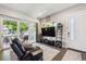 Bright living room featuring a large sliding door, modern decor, and an inviting atmosphere at 2898 W 22Nd Ave, Denver, CO 80211
