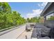 Comfortable seating area on the rooftop deck surrounded by mature trees at 2898 W 22Nd Ave, Denver, CO 80211