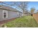 Backyard featuring well-maintained lawn, grey siding and storage shed at 4344 Chase St, Denver, CO 80212