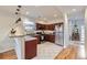 Well-lit kitchen features stainless steel appliances and tiled floors, perfect for cooking and entertaining at 4344 Chase St, Denver, CO 80212