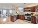 Modern kitchen with stainless steel appliances and granite countertops, flowing into the living area at 4344 Chase St, Denver, CO 80212