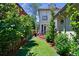 Landscaped backyard featuring artificial grass, trees and shrubs providing privacy at 1164 S High St, Denver, CO 80210