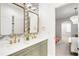 Stylish bathroom features modern fixtures, double vanity, and patterned accent wall at 1164 S High St, Denver, CO 80210