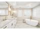 Luxurious bathroom features marble countertops, soaking tub, and elegant fixtures at 1164 S High St, Denver, CO 80210