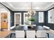 Formal dining room with modern lighting, sophisticated design, and natural light at 1164 S High St, Denver, CO 80210
