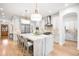 Modern kitchen boasts white cabinets, marble counters, and stainless steel appliances at 1164 S High St, Denver, CO 80210