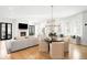 Spacious living room with fireplace, hardwood floors, and elegant lighting at 1164 S High St, Denver, CO 80210