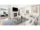 Cozy living room featuring a fireplace, access to patio, and comfortable seating at 1164 S High St, Denver, CO 80210