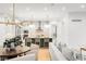 Open-concept living space with a kitchen island, modern lighting, and a comfortable seating area at 1164 S High St, Denver, CO 80210