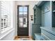 Convenient mudroom with custom storage solutions, bench, and easy access to outdoors at 1164 S High St, Denver, CO 80210