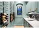 Stylish wine room with black racks, light blue walls, and modern countertop at 1164 S High St, Denver, CO 80210
