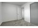 A simple, clean bedroom with neutral colors, a closet, and modern gray carpet at 3525 28Th St # 304, Boulder, CO 80301