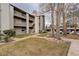 Multi-level apartment building with a well-maintained lawn, mature trees, and pedestrian walkways at 3525 28Th St # 304, Boulder, CO 80301