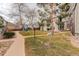 Exterior view of complex buildings surrounded by walkways and mature trees at 3525 28Th St # 304, Boulder, CO 80301