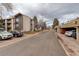 Complex buildings view showing parking and street access, with greenery at 3525 28Th St # 304, Boulder, CO 80301