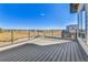 Spacious balcony with a metal railing and wood-like flooring, perfect for enjoying outdoor views at 5920 W 91St Ave, Westminster, CO 80031