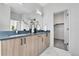 Modern bathroom with a double vanity featuring elegant hardware and lots of storage at 5920 W 91St Ave, Westminster, CO 80031