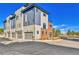 Modern townhome showcasing a contemporary design with clean lines and a mix of siding and brick at 5920 W 91St Ave, Westminster, CO 80031