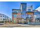 Modern townhome featuring a brick and steel facade, balconies, and contemporary architectural details at 5920 W 91St Ave, Westminster, CO 80031