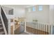 Spacious open-concept interior view from the upper floor with light colored floors and walls at 42958 Colonial Trl, Elizabeth, CO 80107