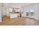 Modern kitchen featuring white cabinets, stainless steel appliances, and a center island at 42958 Colonial Trl, Elizabeth, CO 80107