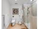 Clean bathroom with toilet, glass shower, and modern decor at 1449 Wynkoop St # 305, Denver, CO 80202