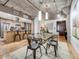 Spacious dining room featuring a glass table, and seamless flow into the kitchen at 1449 Wynkoop St # 305, Denver, CO 80202