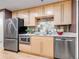 Modern kitchen features stainless steel appliances, and sleek wooden cabinetry at 1449 Wynkoop St # 305, Denver, CO 80202