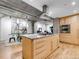 Open kitchen features granite countertops, stainless appliances, and concrete ceiling at 1449 Wynkoop St # 305, Denver, CO 80202