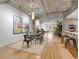Bright and spacious living area with an exposed concrete ceiling, hardwood floors, and modern décor at 1449 Wynkoop St # 305, Denver, CO 80202