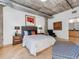 Bright main bedroom featuring modern décor and exposed concrete ceilings at 1449 Wynkoop St # 305, Denver, CO 80202