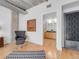 Spacious main bedroom featuring an en-suite bathroom, modern décor and exposed concrete ceilings at 1449 Wynkoop St # 305, Denver, CO 80202