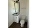 Well-lit bathroom featuring modern fixtures and a stylish granite countertop at 59440 E 56Th Ave, Strasburg, CO 80136