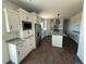 Modern kitchen features granite countertops, stainless steel appliances, and ample cabinet space at 59440 E 56Th Ave, Strasburg, CO 80136