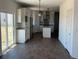 Open-concept kitchen with granite countertops, stainless appliances, and modern cabinetry at 59440 E 56Th Ave, Strasburg, CO 80136