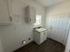 Mud room boasts granite countertop sink, storage, and a convenient exterior door at 59440 E 56Th Ave, Strasburg, CO 80136