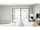 Bedroom featuring a sliding glass door to outdoor courtyard at 3483 S Race St, Englewood, CO 80113