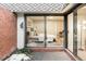 Exterior view of bedroom courtyard, accessed by sliding glass doors at 3483 S Race St, Englewood, CO 80113