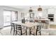 Modern dining area featuring a spacious table, stylish chairs, and an open-concept kitchen at 3483 S Race St, Englewood, CO 80113