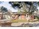 Charming single-story brick home with mature trees, a two-car garage, and inviting curb appeal at 3483 S Race St, Englewood, CO 80113