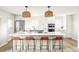 Modern kitchen featuring a spacious island, stainless steel appliances, and pendant lighting at 3483 S Race St, Englewood, CO 80113