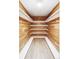 Spacious walk-in closet with custom cedar shelving and ample storage space at 3483 S Race St, Englewood, CO 80113