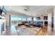 Open living space with large windows, hardwood floors, and modern furnishings at 20249 Terrace View Dr, Parker, CO 80134