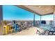 Covered patio area with colorful chairs and expansive views at 20249 Terrace View Dr, Parker, CO 80134