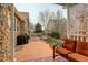 Cozy backyard patio featuring stone accents, grill, and comfortable seating area with pergola at 21270 E Eldorado Dr, Aurora, CO 80013