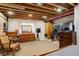 Finished basement bedroom with dresser, closet, and comfortable lounging area at 21270 E Eldorado Dr, Aurora, CO 80013